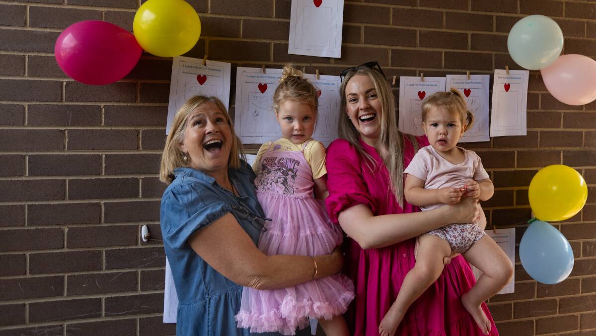 Angelique Richards and Charlotte, 3, Elizabeth and Penelope Howell, 1, celebrating Mother's Day at St Nicholas Early Education Centre Maitland. Picture by Jonathan Carroll