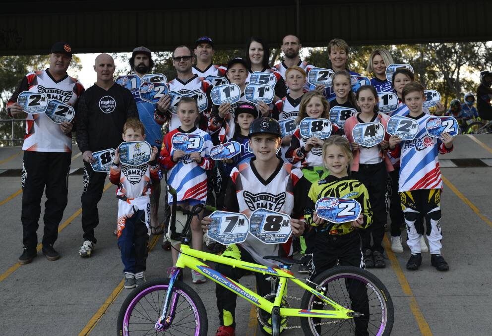 SUCCESS: Maitland Tenambit BMX Club riders proudly display the plates they won at the recent state titles. Picture: Michael Hartshorn