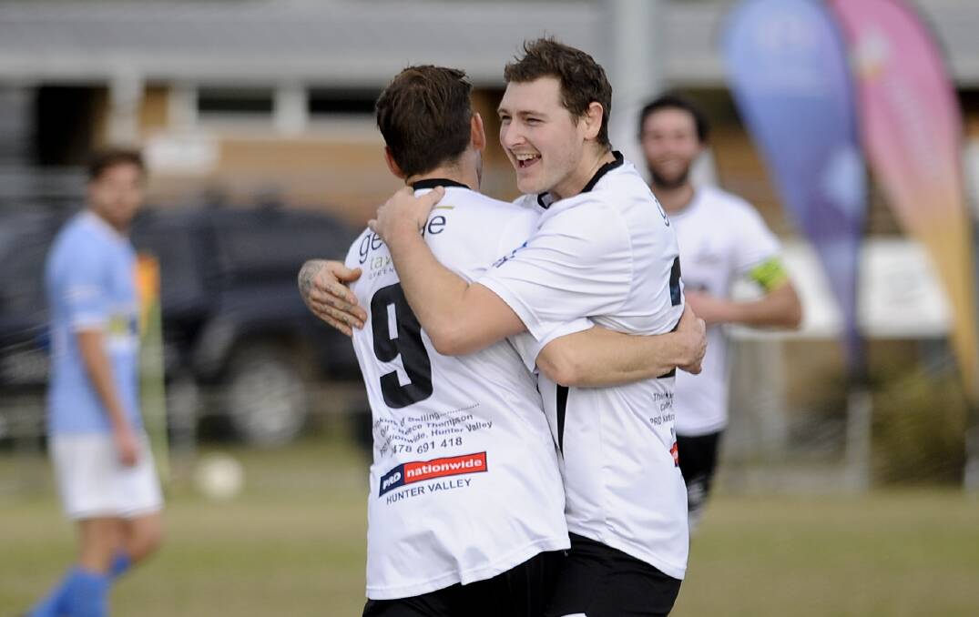FINALS BOUND: Dean Heffernan (left) is congratulated by Ben Martin after scoring in the Magpies 3-2 win against the Weston Bears. Picture: PERRY DUFFIN