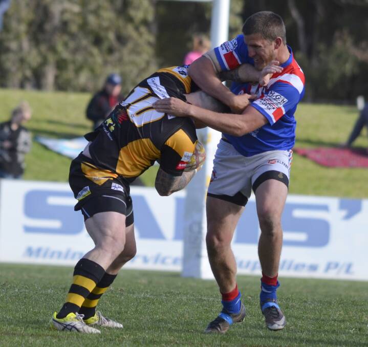 GOTCHA: Cessnock's Kori Barber is stopped in his tracks by the Bulldogs defence in Saturday's Coalfields clash at Cessnock Sportsground. Picture: Amanda Hafey.