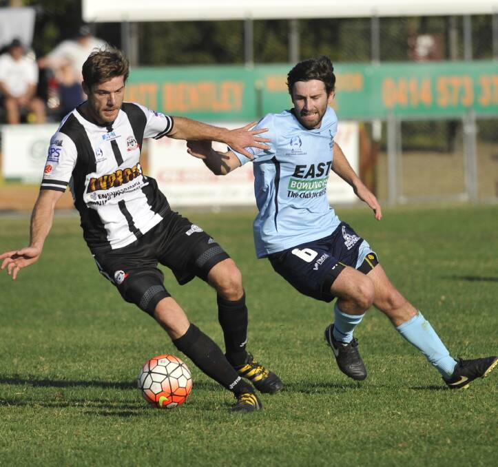 GAME BREAKER: Maitland Magpies' Ryan Broadley chases Weston Bears Rob MacBeth. Broadley scored a double and had a hand in the other Magpies goal. Picture: PERRY DUFFIN