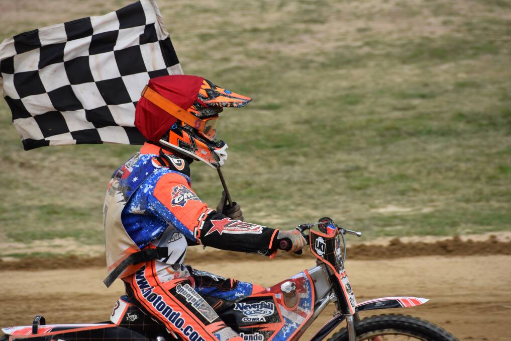 CHAMP: Cowra's Matthew Gilmore on his victory lap after claiming the NSW Under-21 Speedway title at Kurri Kurri on Saturday. Picture: Michael Hartshorn
