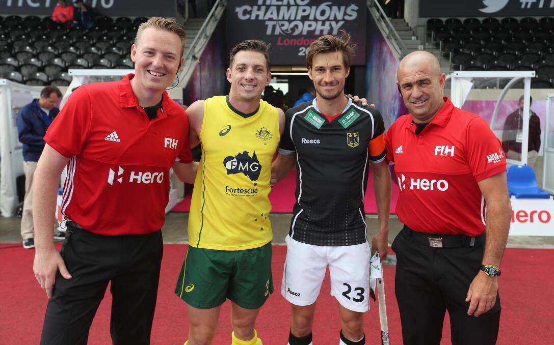 MILESTONE: Simon Orchard of Australia and Tobias Fuchs of Germany with match officials prior to Champions Trophy match.