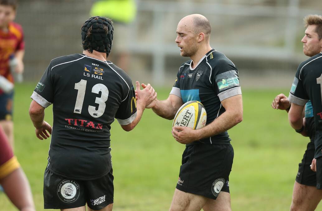 DOUBLE: Joe Lavis (13) congratulates Rob Williamson after one of his two tries. Picture: MARINA NEIL