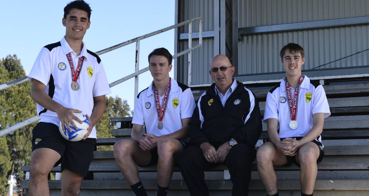 SUCCESS: Australian youth futsal team members Jed Horder, Lachlan Hodgetts and Thomas Oliver with team manger Manny Tserepas. Picture: MICHAEL HARTSHORN