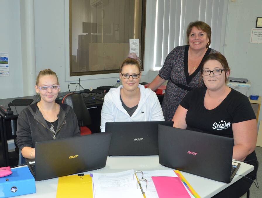 CONFIDENCE AND SKILLS: WEA Hunter foundation support worker Angela Griffith (standing) with The Village Kurri Kurri students Skye Cousins, Shannon Bisset and Belle Stuart. Picture: Krystal Sellars