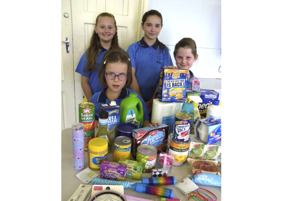 SUPPORT: Kurri Kurri Girl Guides Saranah Richards, Isabelle O’Keefe, Ashley Roberts and Lexxis Bailey with examples of the items they will be collecting for Carrie's Place.