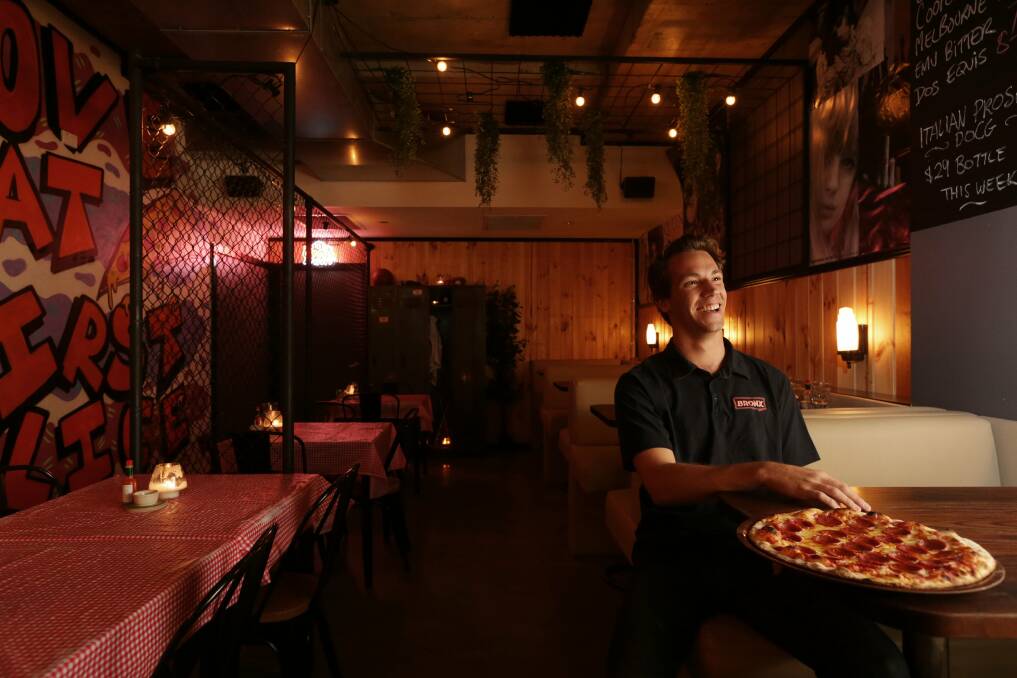 Liam Beletich with a Peppertony pizza at Bronx Pizza. Picture:  Simone De Peak.