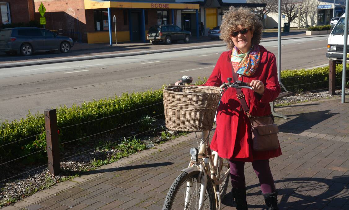 DEFIANT: Sue Abbott with her bicycle in Scone on Thursday morning. She remains determined to continue her fight against helmet laws.