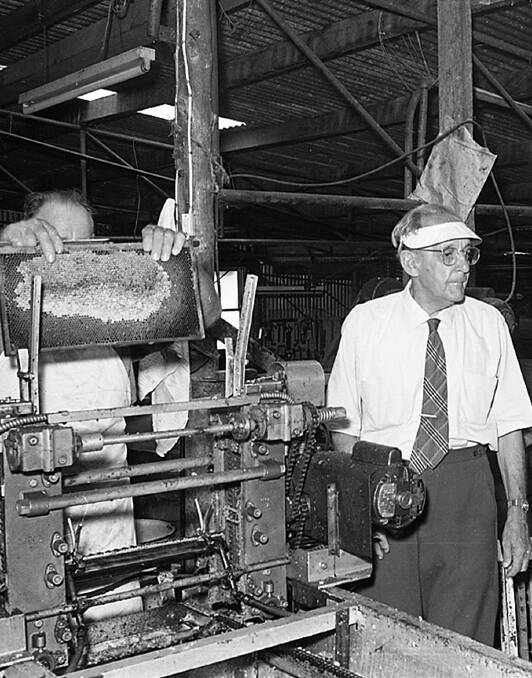 TIMES PAST: Penders managing director Mr Wynn Pender, at right, at the factory that was located where Pender Place shopping centre is now. Pictures: Photographed by the late Alan Bennett, supplied by Pete Smith