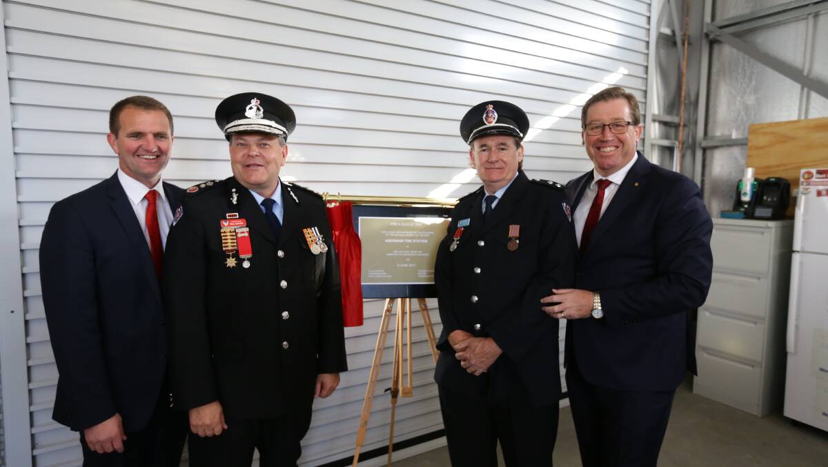 OPEN: Cessnock MP Clayton Barr, Commissioner Paul Baxter, Abermain Fire Brigade captain Bill Lang and emergency services minister Troy Grant at the station. Picture: Jonathan Carroll