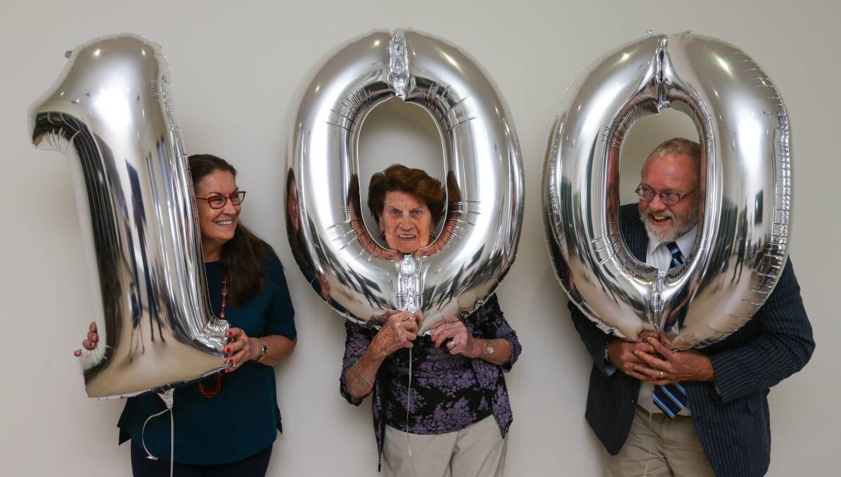 SPARKLING: Merle Phillipps, centre, celebrates her 100th birthday with daughter Jenny Wilkinson and son Tony Phillipps. Picture: Jonathan Carroll