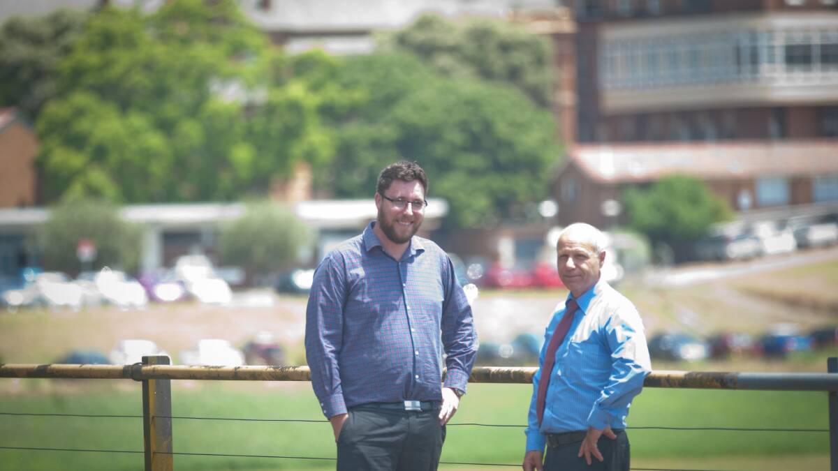 FLASHBACK: NSW Health Infrastructure senior project director Troy Harvey, left, with Hunter New England Health chief executive Michael DiRienzo in front of the existing Maitland Hospital site IN 2016. Picture: Michael Hartshorn