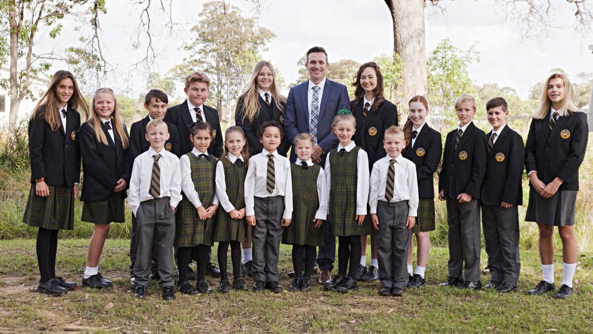 INCLUSIVE: Principal Darren Cox, pictured centre, with students from junior, middle and senior schools at St Philip's College Cessnock.