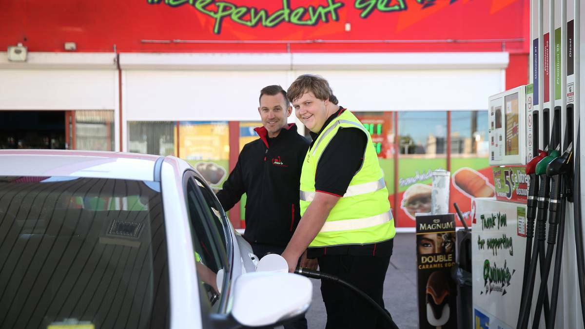 PUMP IT: David Gibbs is Quinn's new driveway attendant. He is pictured with Mark Woodbridge, co-owner of Quinn's on Melbourne Street. Picture: Marina Neil.