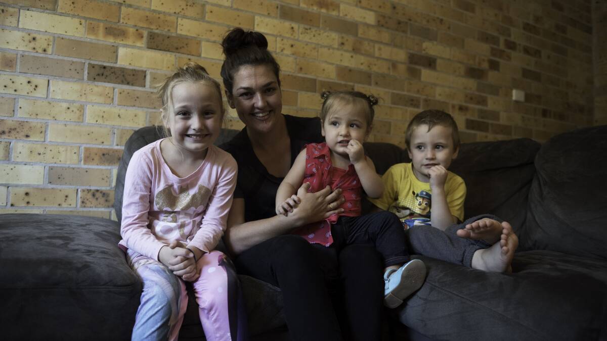 GROWN UP: Chelsea Mordue (centre) with her mother Krystle and siblings Lily and Travis. Two years ago they were ferried across floodwater to safety when the premature Chelsea needed urgent medical treatment.