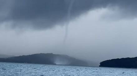 A water spout whipped across Lake Macquarie on Sunday. Picture is a snapshot from a video by Carmel Bell