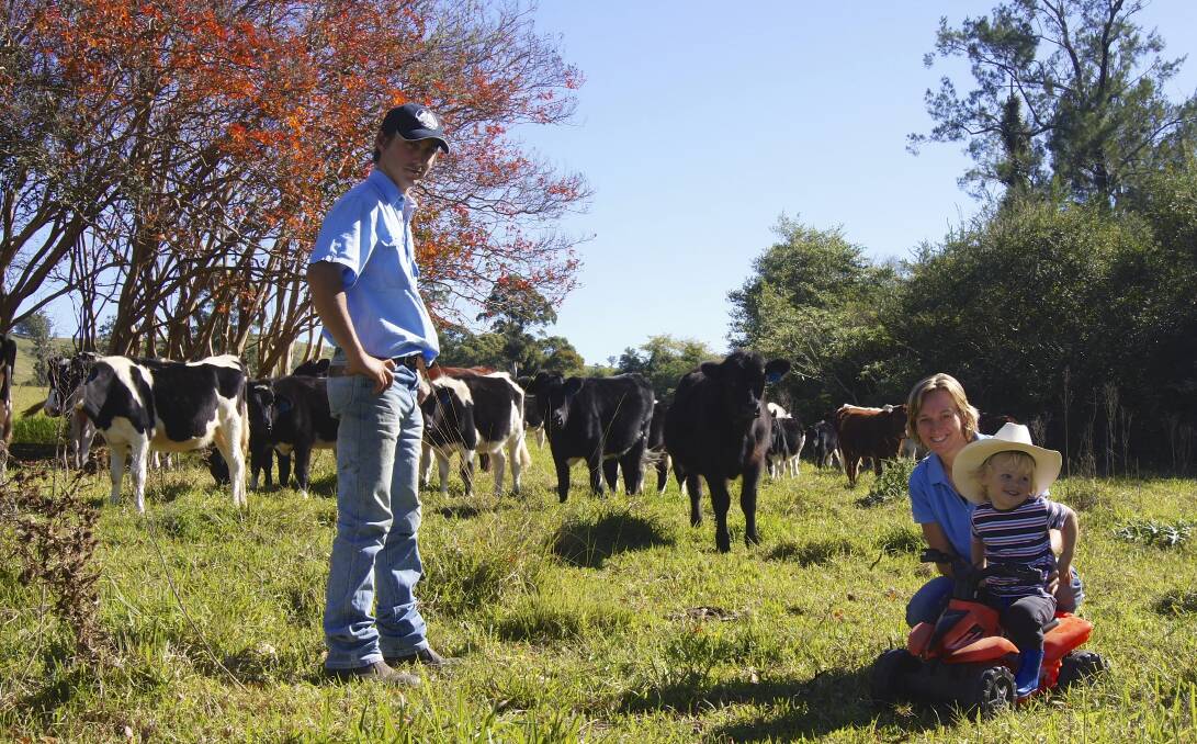 PRICE DROP: Dairy farmers Matt and Emily Neilson, pictured on their Bandon Grove farm with their son Joseph, have had their income slashed.