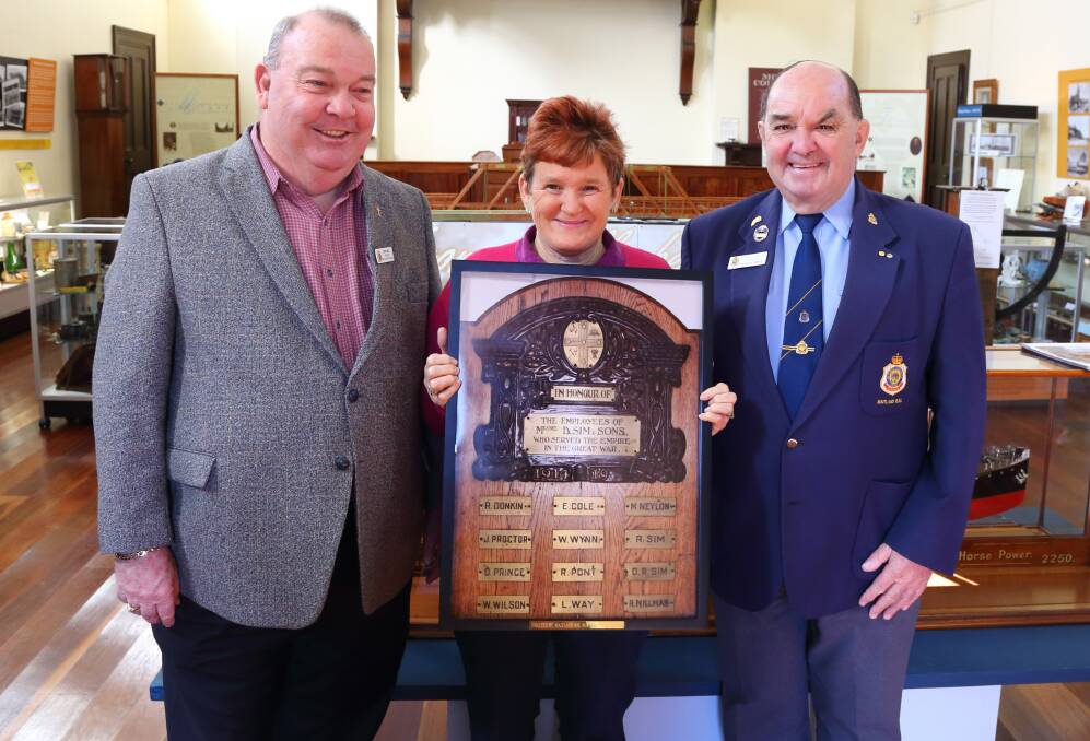 RESTORED: Maitland RSL Sub Branch president and chaplain Eric Bell (left) and secretary Fred Goode (right) with Morpeth Museum management secretary Elvie Dorn.