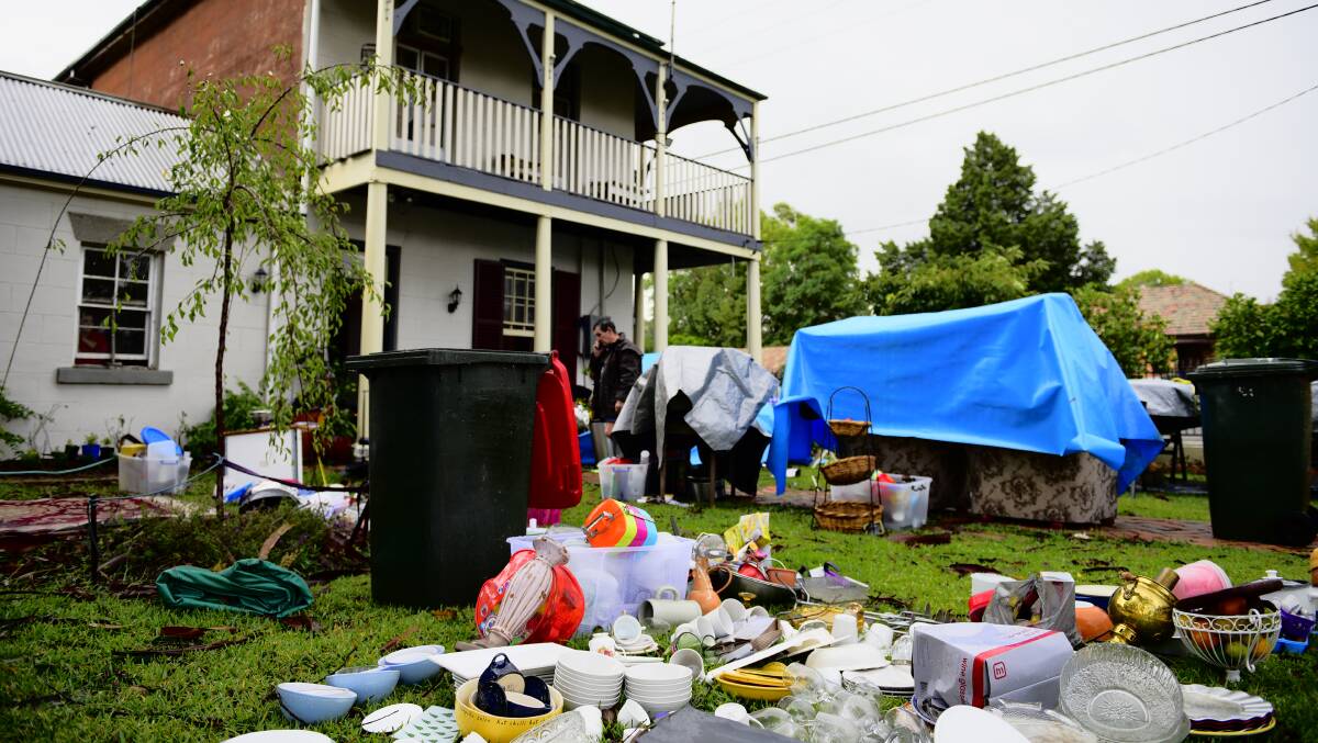 DAMAGE: Paul Manyweathers had to sort through his belongings on the front lawn.