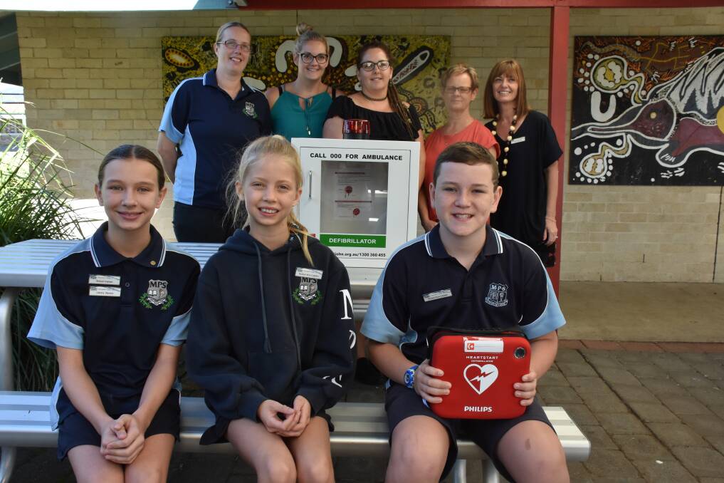 HELP: captain Sophie Jane Formosa and vice captains  Sophie Jane Gadd and Ryan Eveleigh-Tanks (front) with some members of the school community. 