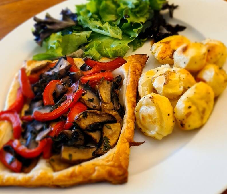 Mushroom and capsicum galette with roast potatoes and green salad made from food scraps. 