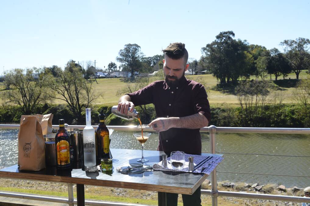 INDULGE: The Whistler's bar manager Dane Cottee making an espresso martini on the riverbank. Picture: Belinda-Jane Davis