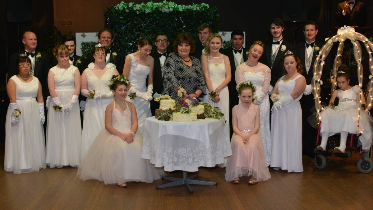 DEBUTANTE BALL: The debutantes, their partners, the flower girls and organiser Jenny Hitchcock (centre) pose for a photograph.Picture: Stephen Hunt Photography 