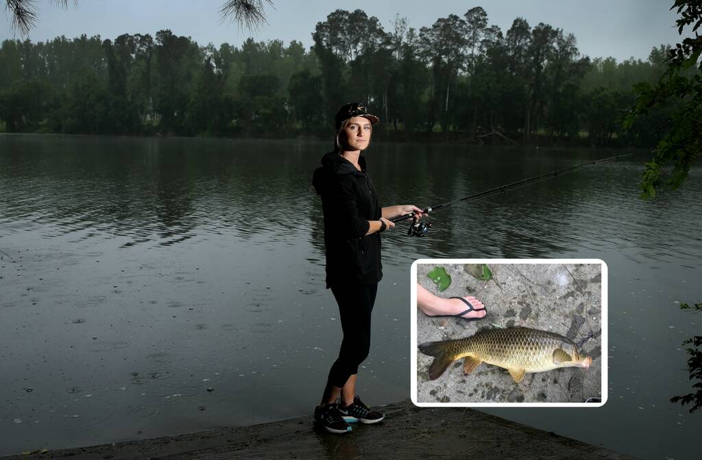 CARP: Ellie Burke, of Clarence Town, at the boat ramp on her property where she reeled in a 70 centimetre carp in 2016. Insert: the carp. Main picture: Marina Neil.