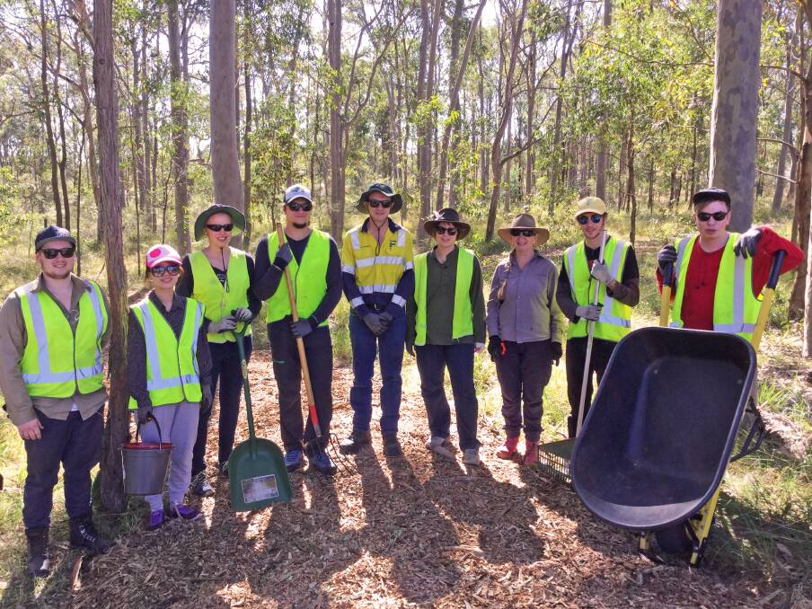 GIVING BACK: International and local volunteers with Boral employees and Thornton Public School landcare coordinator Karen Brown (third from right). Picture: Supplied