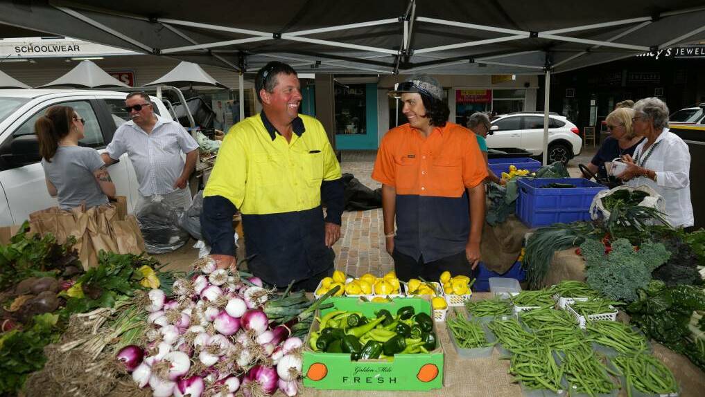 FARMING: Matthew and Liam Dennis at their Slow Food Earth Markets stall in The Levee earlier this year. Picture: Jonathan Carroll.