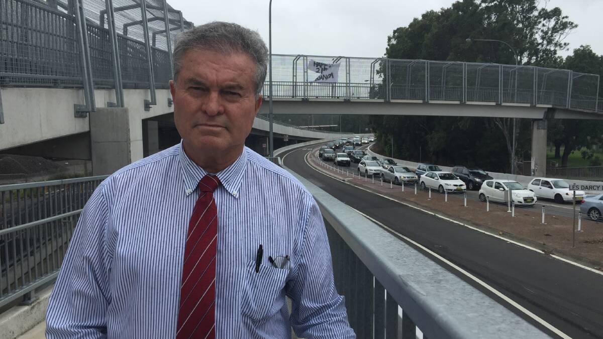 FIX THIS: Maitland councillor Bob Geoghegan has called for a quick solution to traffic gridlock at the roundabout near Maitland railway station.