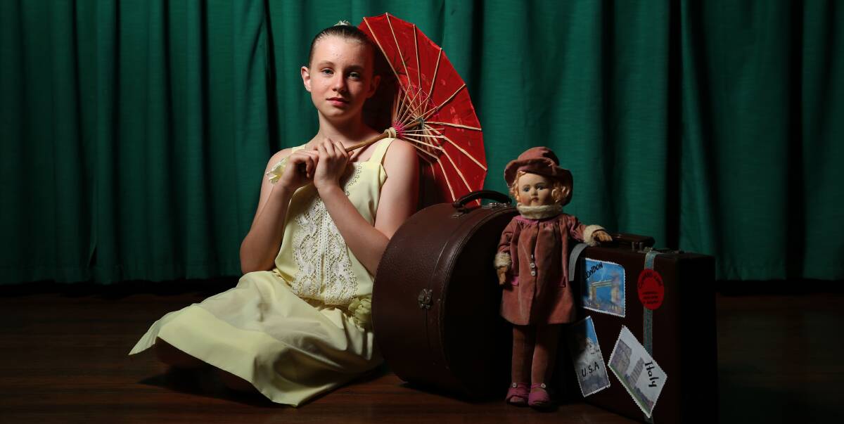 PERFORMANCE: Dancer Macy Brunt, 12, posing for a picture with the doll that is taking centre stage in the Hunter Valley Dance Centre production Half A World Away. Picture: Max Mason-Hubers.