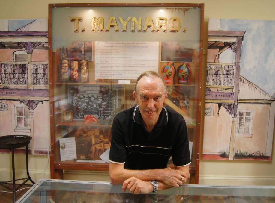 EXHIBITION: Morpeth Museum volunteer Alan Todd with the original windowpane that used to greet shoppers outside 148 Swan Street. Picture: Belinda-Jane Davis