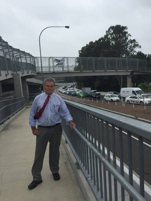 FIX THIS: Maitland councillor Bob Geoghegan has called for a quick solution to traffic gridlock at the roundabout near Maitland railway station. 