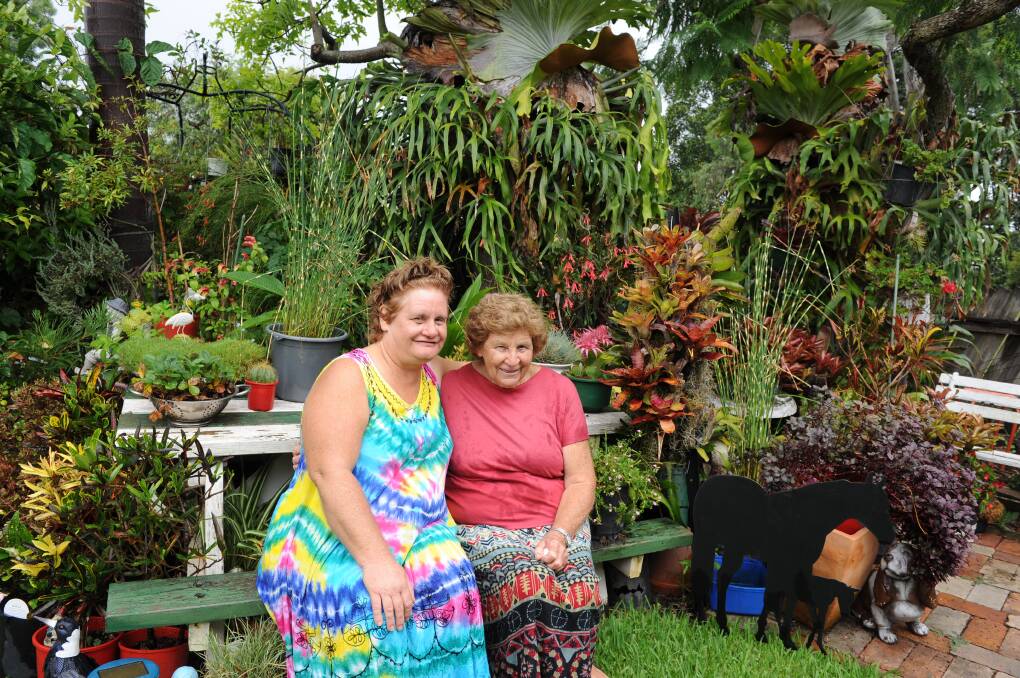 GARDENING PALS: Elysee and Val Robinson sit among some of their plants. 