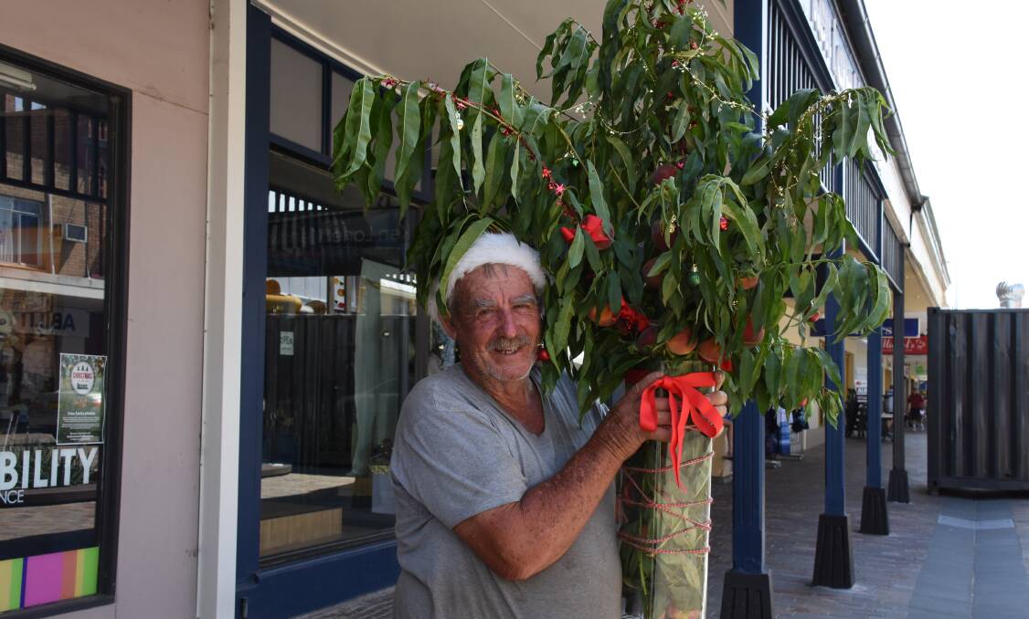 FESTIVE RESCUE: Farmer Tony Milburn with some of the Medowie peaches that will return to the Slow Food Earth Market in The Levee on Thursday. Picture: Belinda-Jane Davis