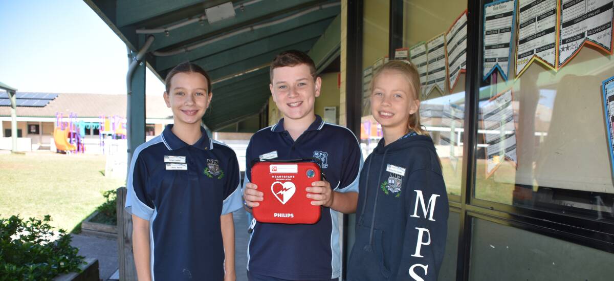 DONATION: Morpeth Public School captain Sophie Jane Formosa and vice captains Ryan Eveleigh-Tanks and Sophie Jane Gadd. 