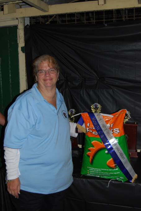 DELIGHTED: Show secretary and exhibitor Amanda Winney with the ribbon and prize she won at the show. 