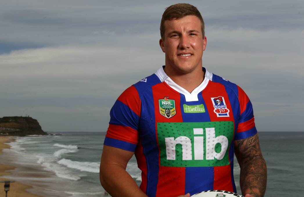 SIGN OF THE TIMES: Knights skipper Trent Hodkinson models Newcastle's 2017 jersey, featuring nib as major sponsor. Picture: Jonathan Carroll