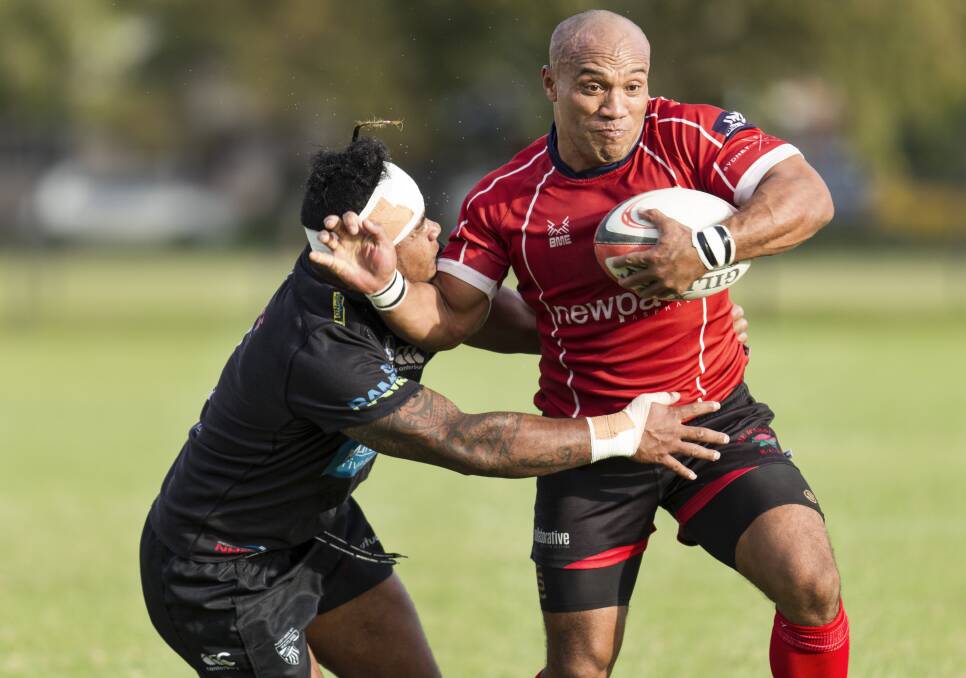 GOING: Waratahs inside centre Carl Manu takes on the Maitland defence last season. Picture: Stewart Hazell