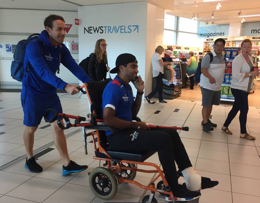 ON THE MEND: Jets physiotherapist Justin O'Dougherty and Ronny Vargas at Brisbane Airport on Monday.