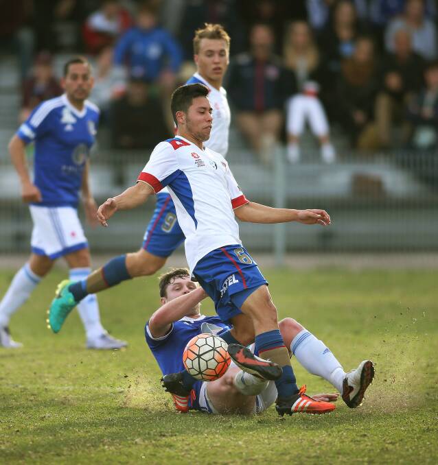 FRESH START: Maitland recruit Andrew Pawiak is tackled while playing for the Newcastle Jets Youth side in the NNSW NPL against Hamilton Olympic last year. Picture: Marina Neil