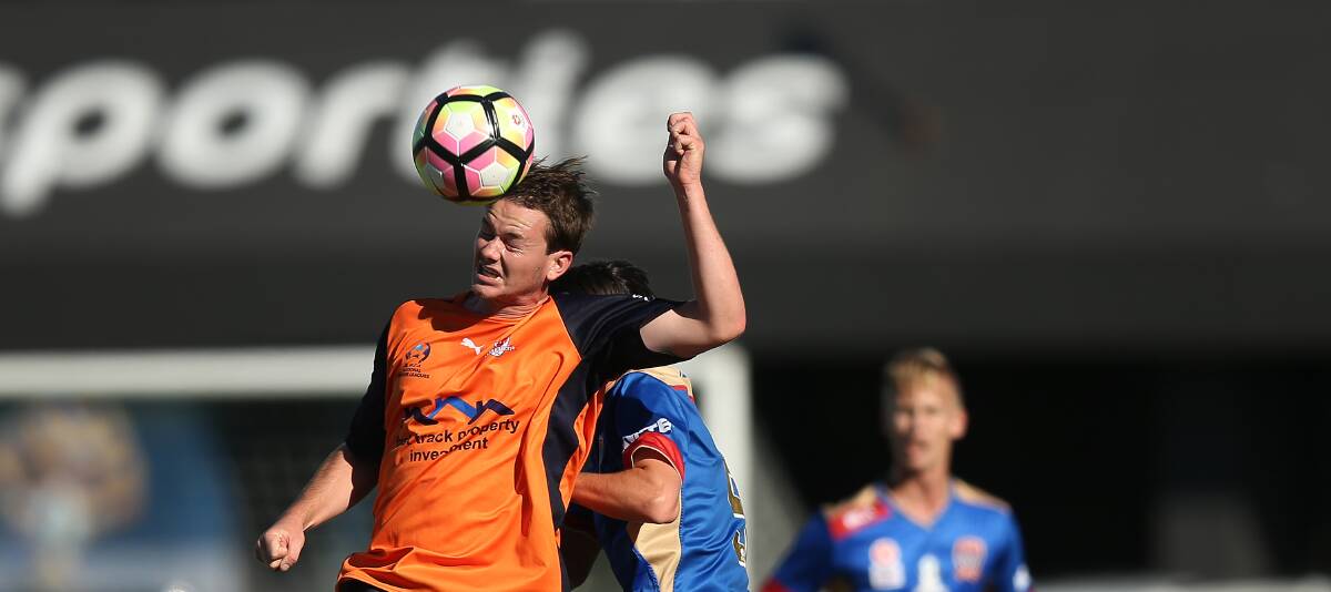 JUST AHEAD: Valentine's Josh Murray, a former Newcastle Jets Youth player, wins a header over Kieran Hayes on Saturday in their round eight NPL 1-0 victory at Cahill Oval. Picture: Marina Neil