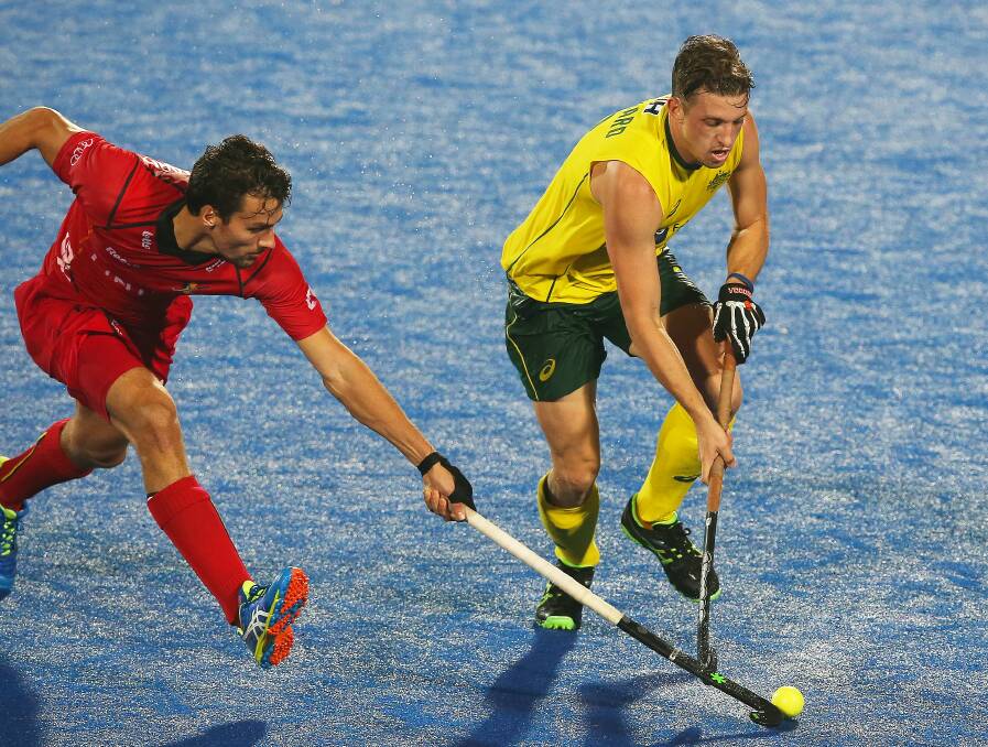ON THE BALL: Simon Orchard, right, in action for Australia against Belgium at the Hockey League World Finals in India last November. The midfielder has played more than 200 games for the Kookaburras. Picture: Getty Images