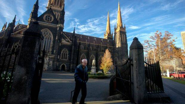A parishioner at St Patrick's Cathedral on Sunday morning.  Photo: Luis Ascui
