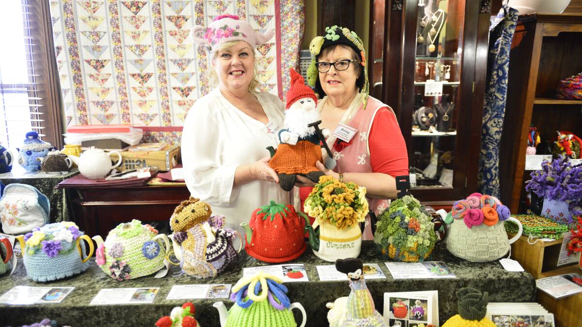 TIME FOR TEA: Campbell's Store antiques manager Mandi Bryson and co-owner Shirley Richards at the store on Sunday. Picture: Sage Swinton