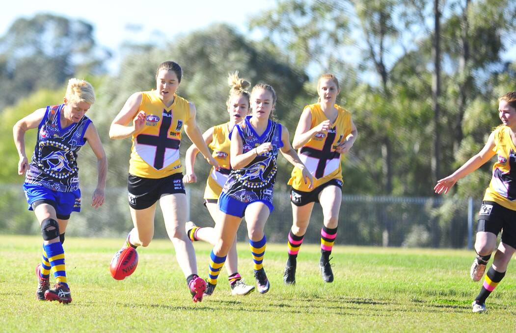 CHASE: Maitland Saints women during their clash with Nelson Bay last weekend. Picture: MICHAEL HARTSHORN