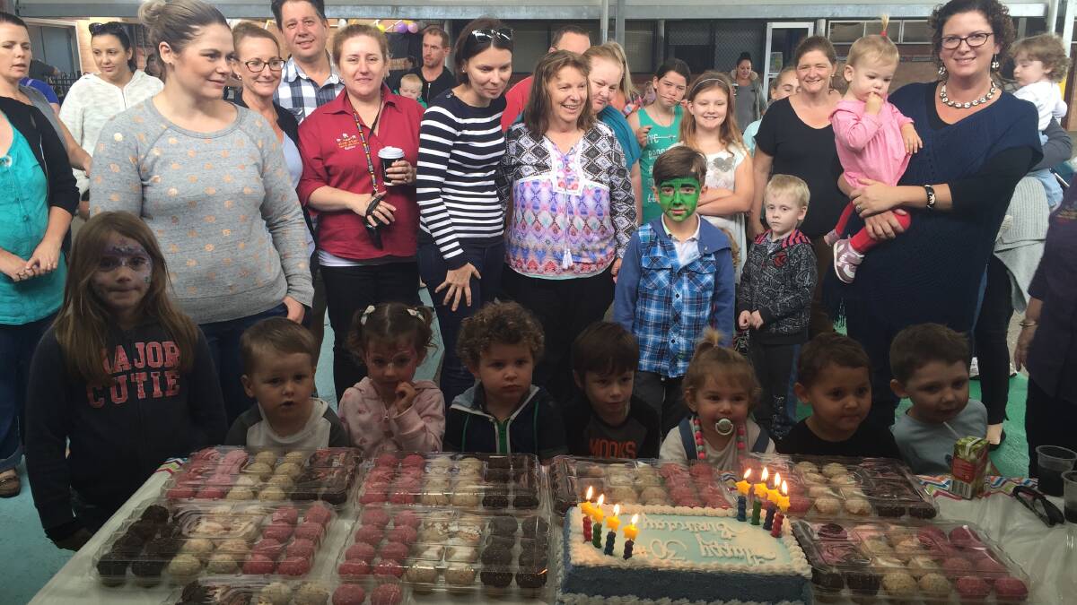 CELEBRATION: Kids cut the cake at Five Star Family Day Care Maitland's 30th birthday and National Family Day Care Week family fun day.