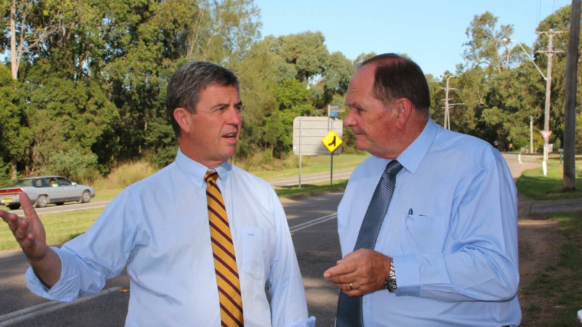 UPGRADE: Federal Member for Lyne Dr David Gillespie MP inspects the intersection of Tocal Road and Maitland Vale Road with Maitland Mayor Cr Peter Blackmore.
